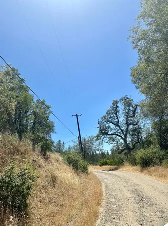 a view of a road with a yard