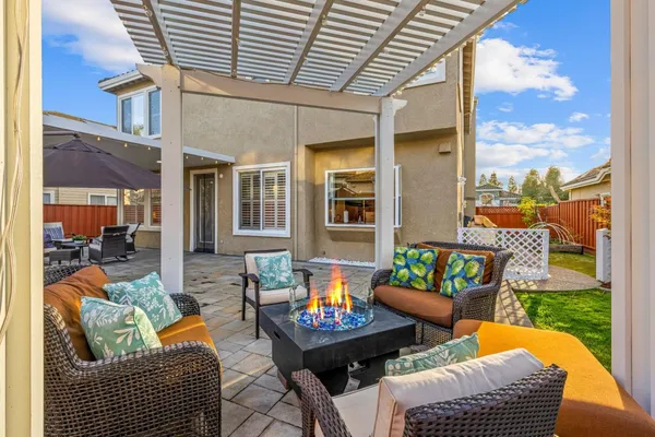a outdoor living space with patio furniture and garden view