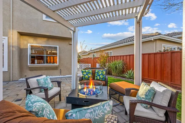 a outdoor living space with furniture and a flat screen tv