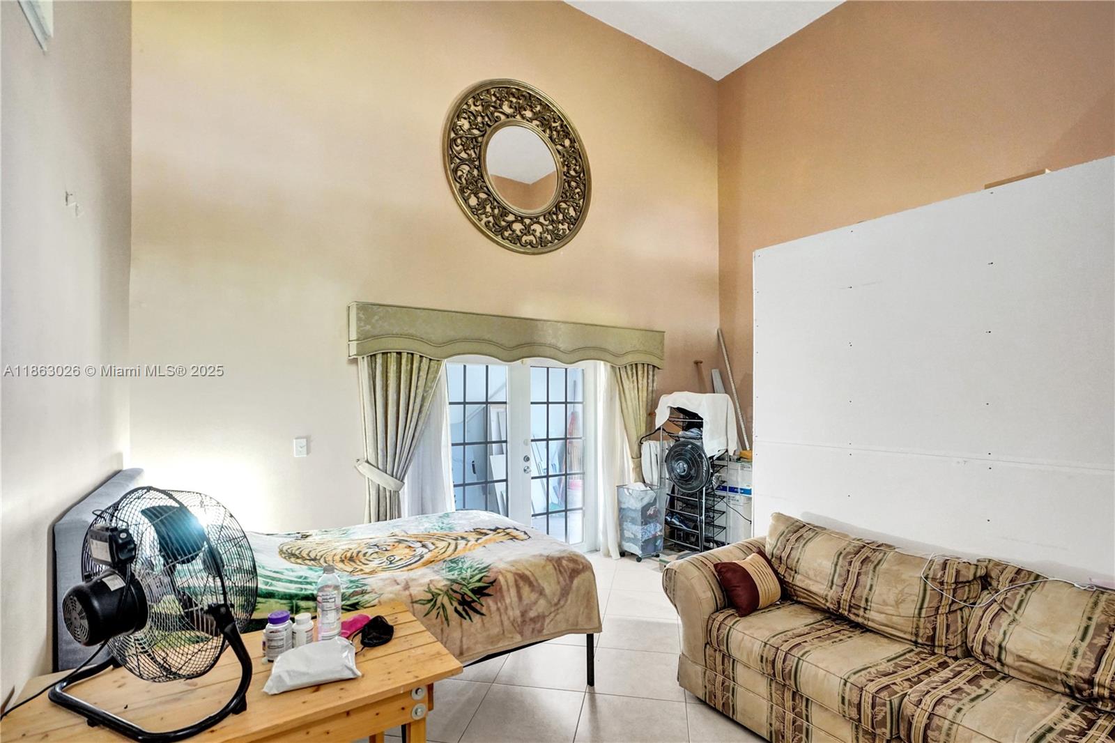 14824 Southwest 180th Street Miami, FL 33187 - Photo 11 of 49 a living room with furniture and a window