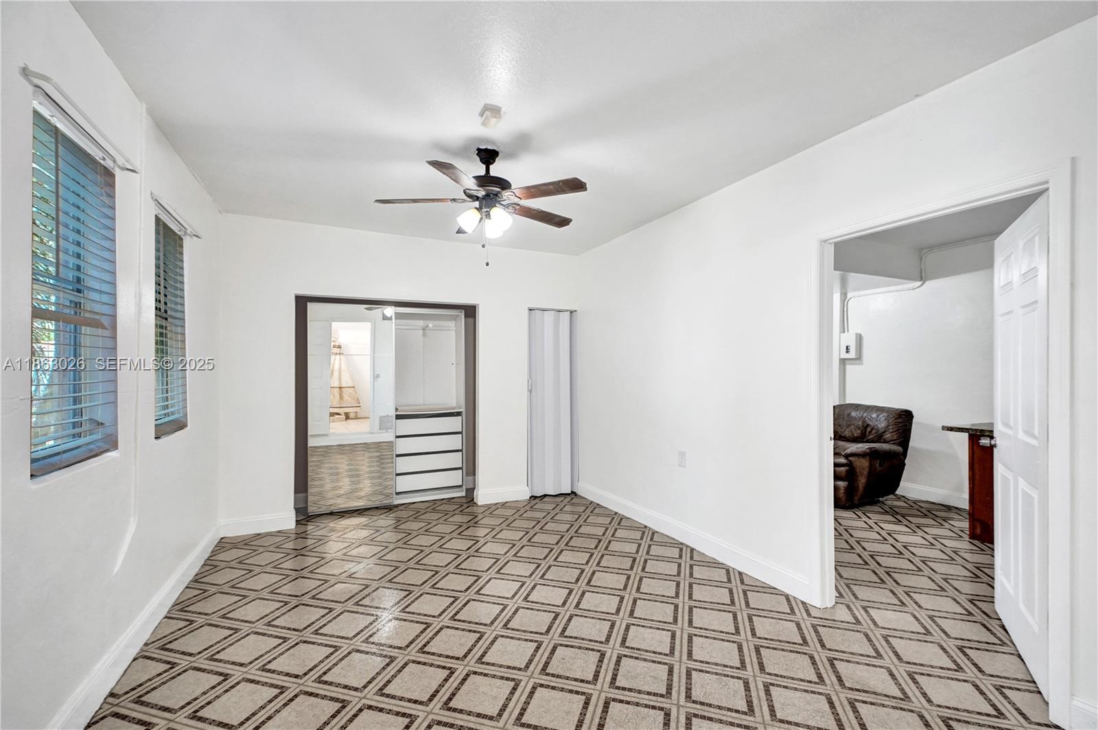 14824 Southwest 180th Street Miami, FL 33187 - Photo 20 of 49 a view of a hallway view with wooden floor and workspace