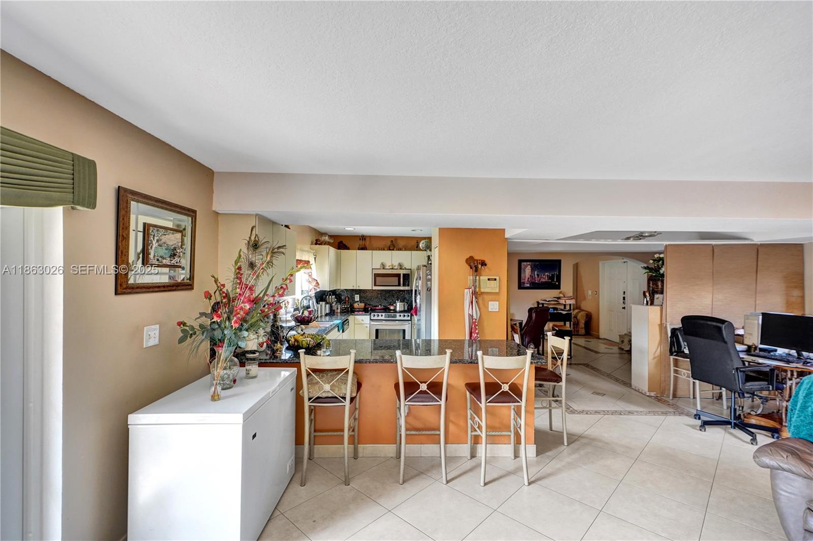14824 Southwest 180th Street Miami, FL 33187 - Photo 28 of 49 a view of a dining room with furniture and a window
