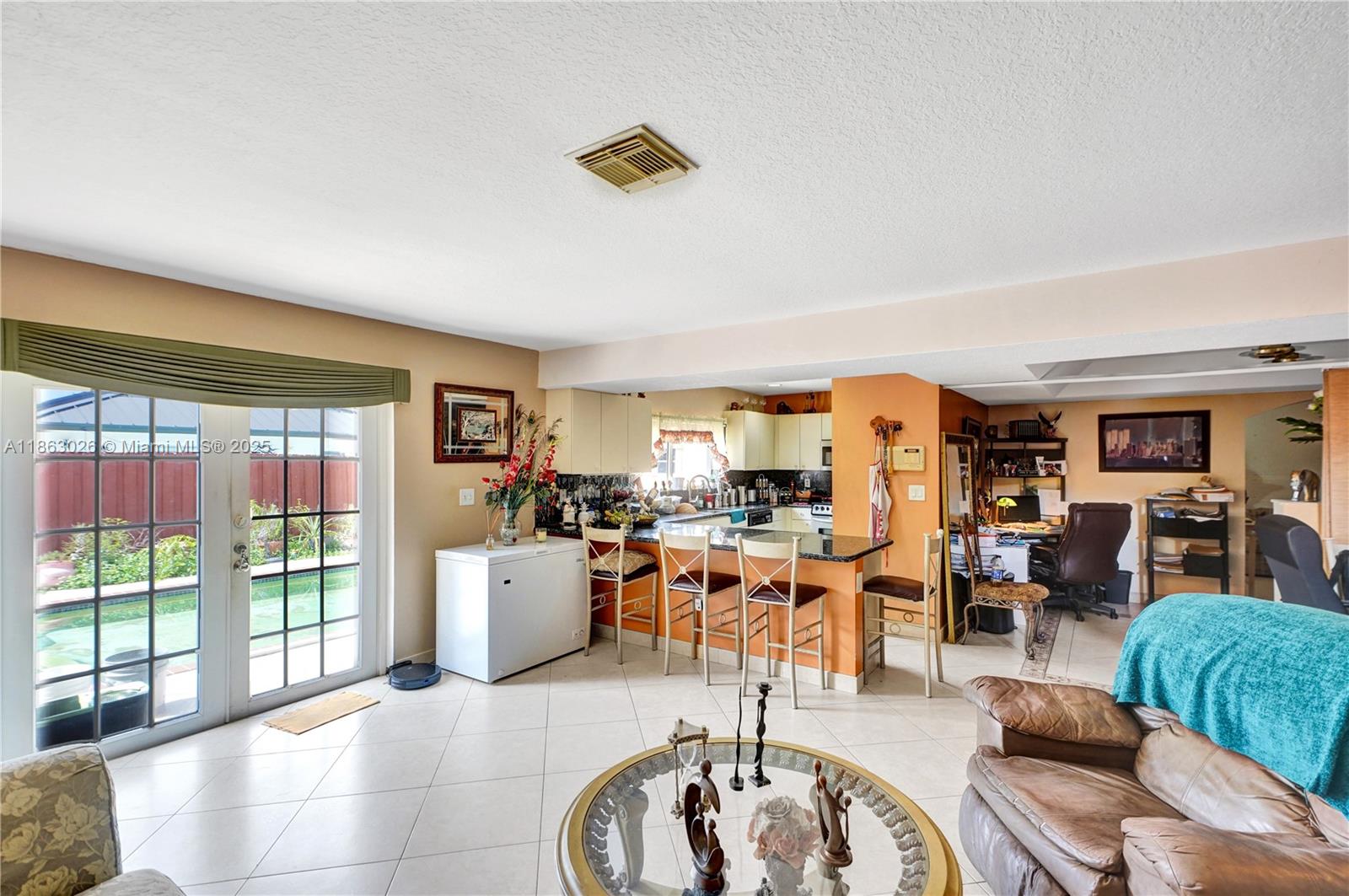 14824 Southwest 180th Street Miami, FL 33187 - Photo 29 of 49 a living room with furniture and a large window