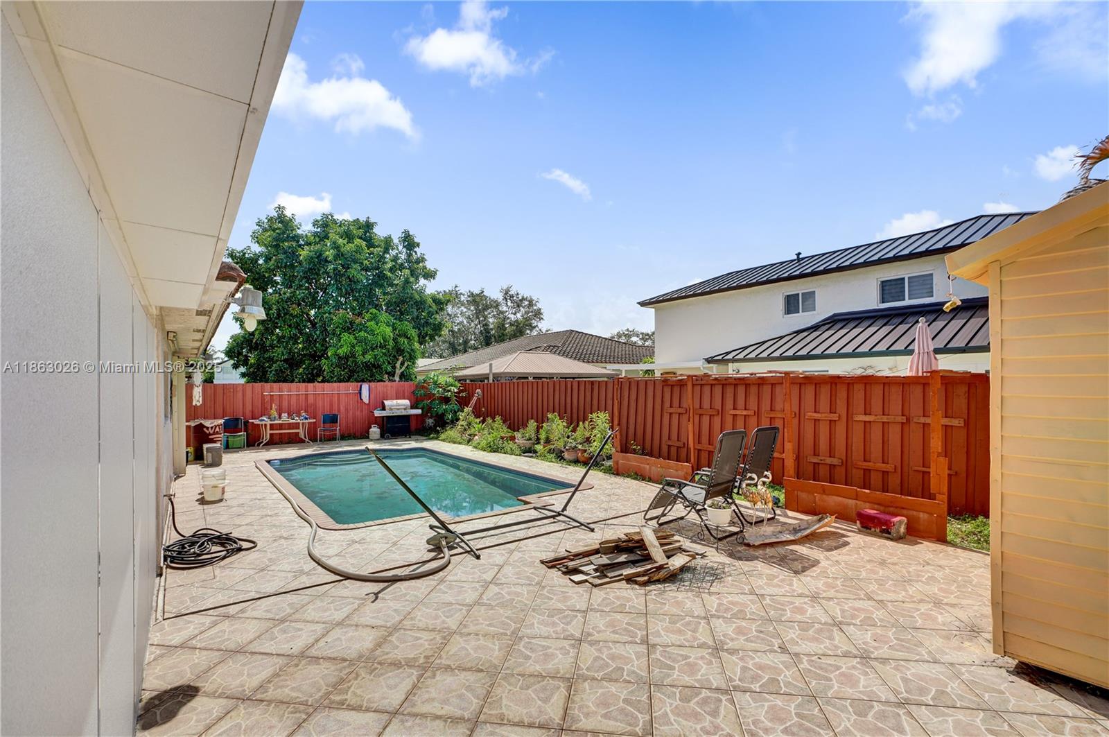 14824 Southwest 180th Street Miami, FL 33187 - Photo 34 of 49 a view of outdoor space with seating area