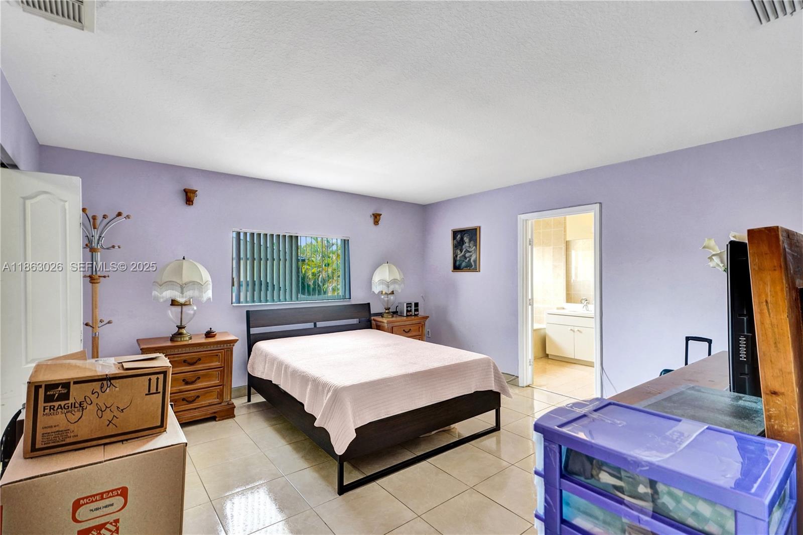 14824 Southwest 180th Street Miami, FL 33187 - Photo 38 of 49 a bedroom with a bed and a window