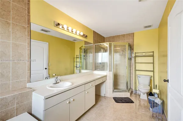 a bathroom with a sink double vanity and a shower