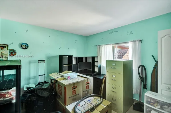 a utility room with multiple dryer and washer
