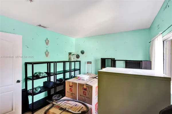 a room with furniture and a large window