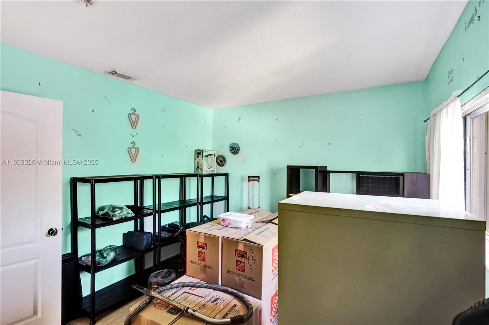 14824 Southwest 180th Street Miami, FL 33187 - Photo 47 of 49 a room with storage and utility
