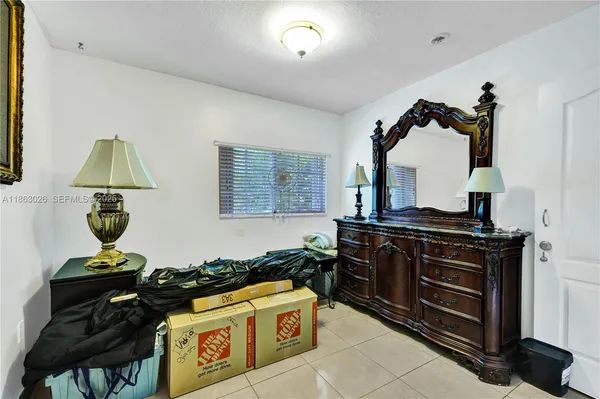 a kitchen with a stove and a wooden floors