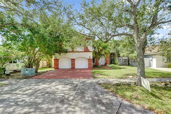 a house with trees in front of it
