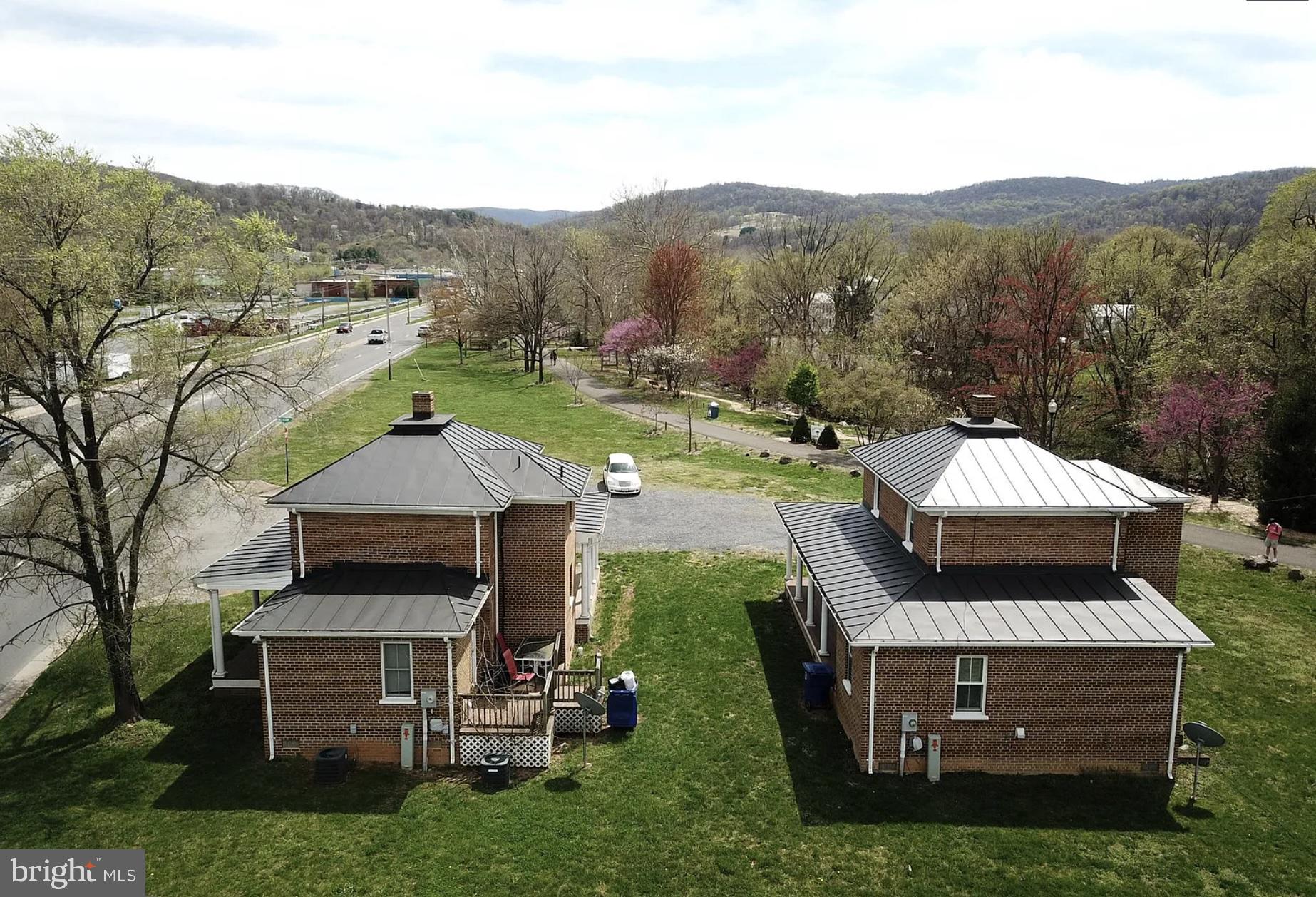604 Radham Street Front Royal, VA 22630 - Photo 3 of 12 an aerial view of a house with a garden and large trees