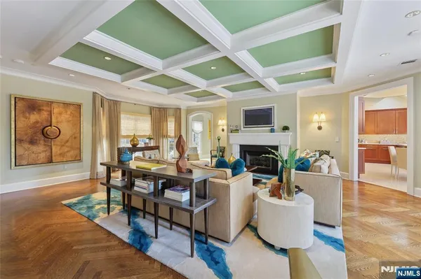 a spacious bedroom with a bed and a chandelier