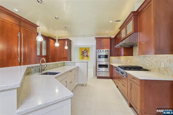 a spacious bathroom with a toilet sink and shower