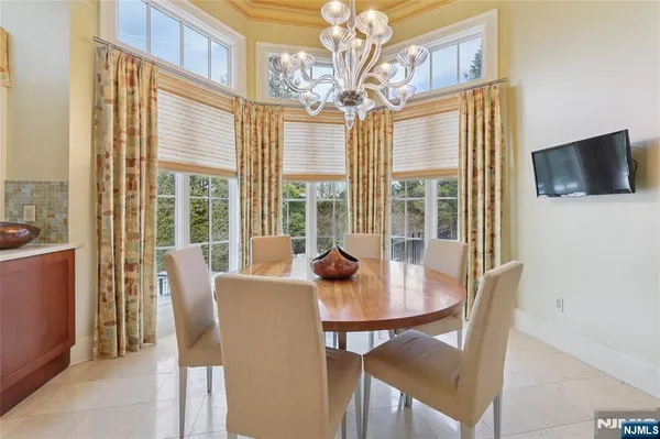 a view of a livingroom with furniture window and wooden floor