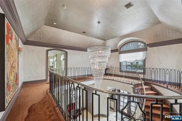 a view of a livingroom with furniture and a flat screen tv