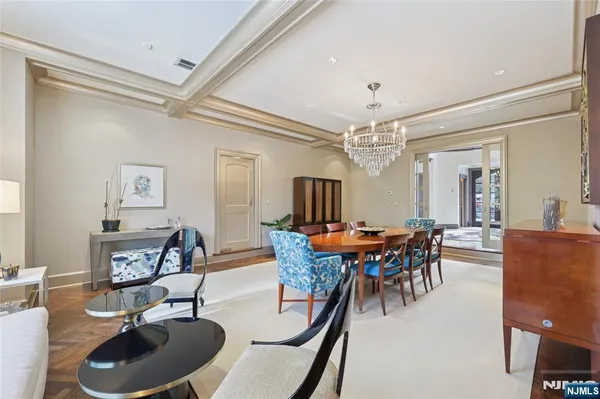 a living room with fireplace furniture and a large window