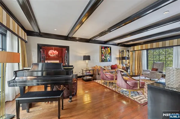 a living room with stainless steel appliances kitchen island granite countertop furniture and a kitchen view