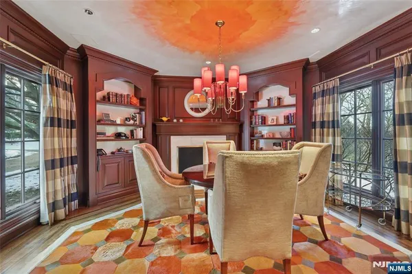a dining room with furniture window and outside view