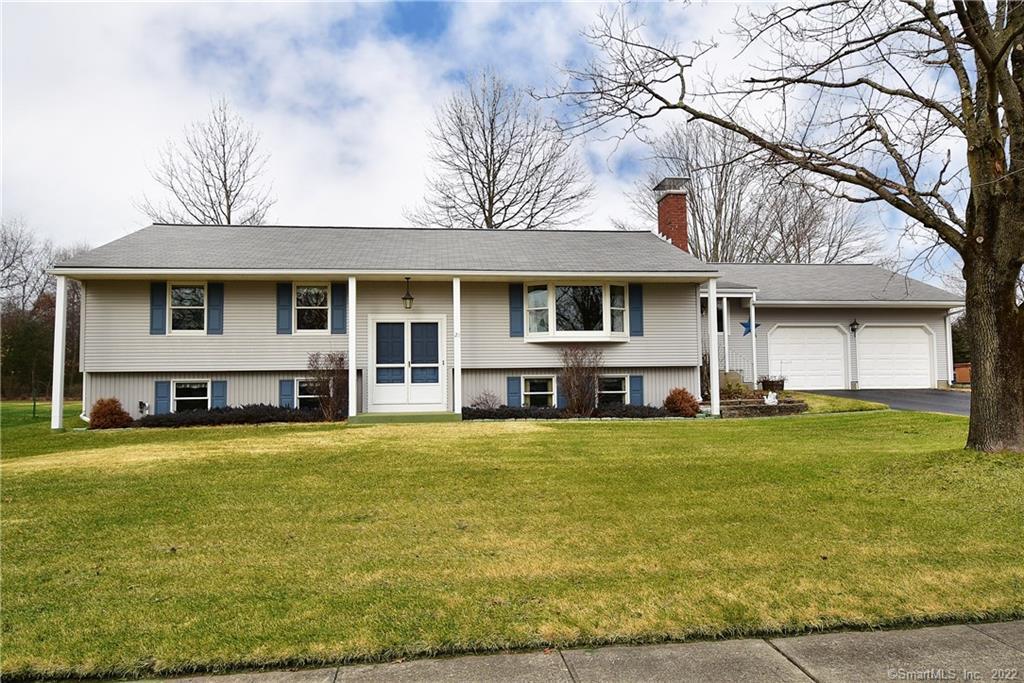 21 Windmill Road Enfield, CT 06082 - Photo 1 of 1 a view of a house with a yard and sitting area