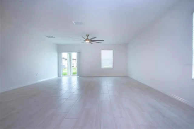 an empty room with a empty space and a window