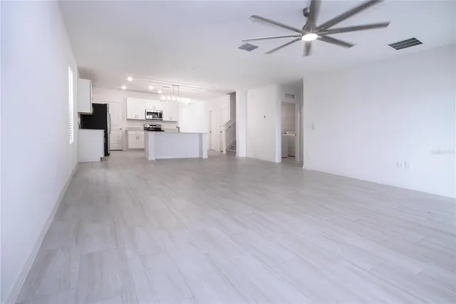 a bathroom with a double vanity sink toilet and shower