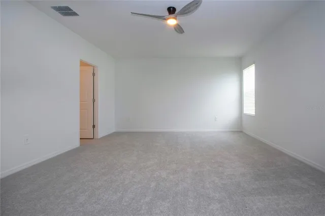 a bathroom with a sink toilet and a mirror