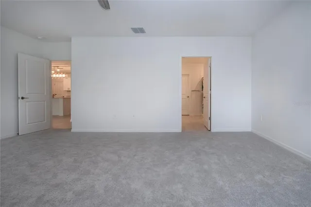 an empty room with an empty space and a window