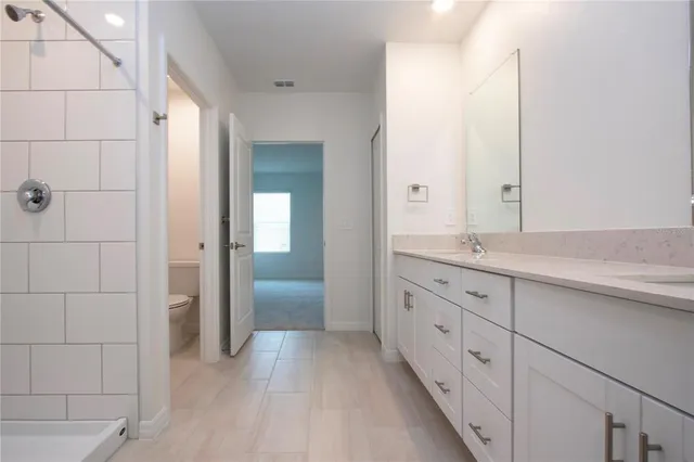 a bathroom with a sink and mirror