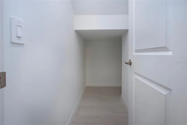 a view of a lake with houses in the back