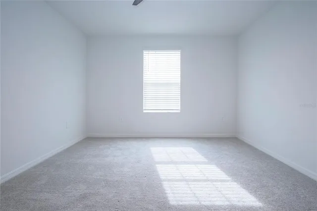 a view of a park that has a sign board on both side of it