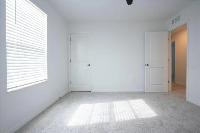 an aerial view of a house with swimming pool and outdoor seating