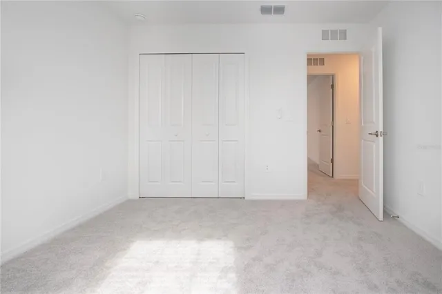 an aerial view of a house a yard and outdoor seating