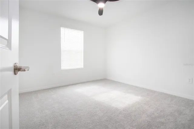 an aerial view of residential house with outdoor space and swimming pool