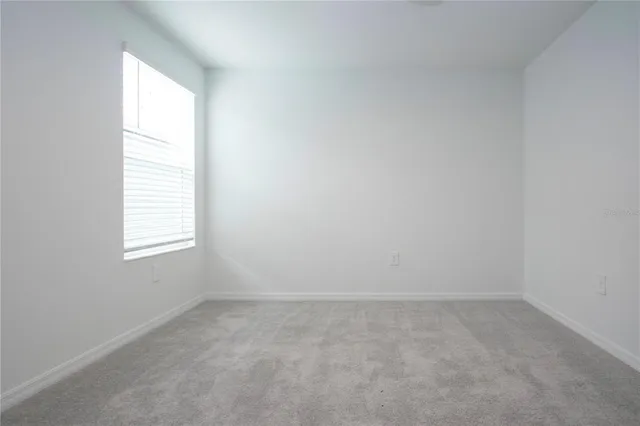 an aerial view of a house with garden space and outdoor seating