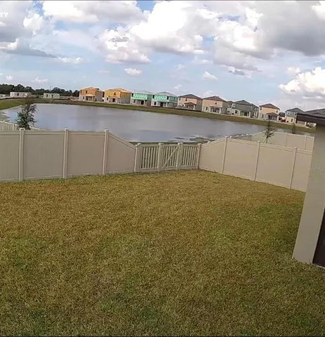 a kitchen with granite countertop a table and chairs