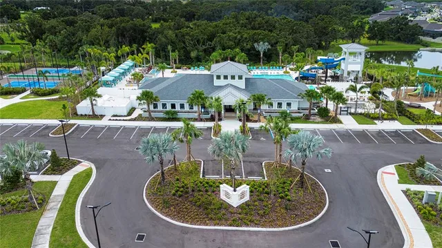 a room with a large window and chandelier