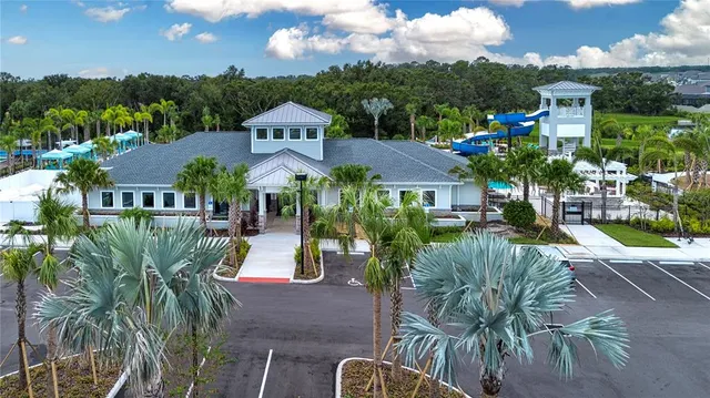 a living room with furniture gym equipment and a large window