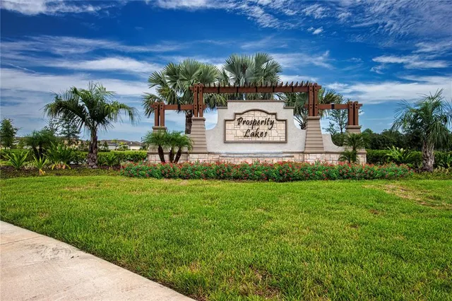 a kitchen with a table chairs and a large window