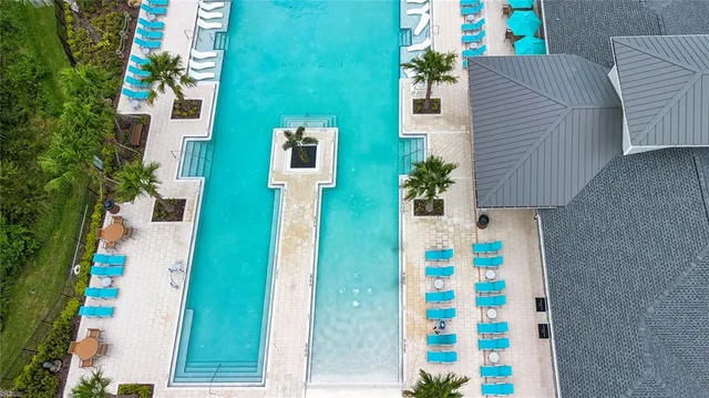 a view of a patio with dining table and chairs with a small yard