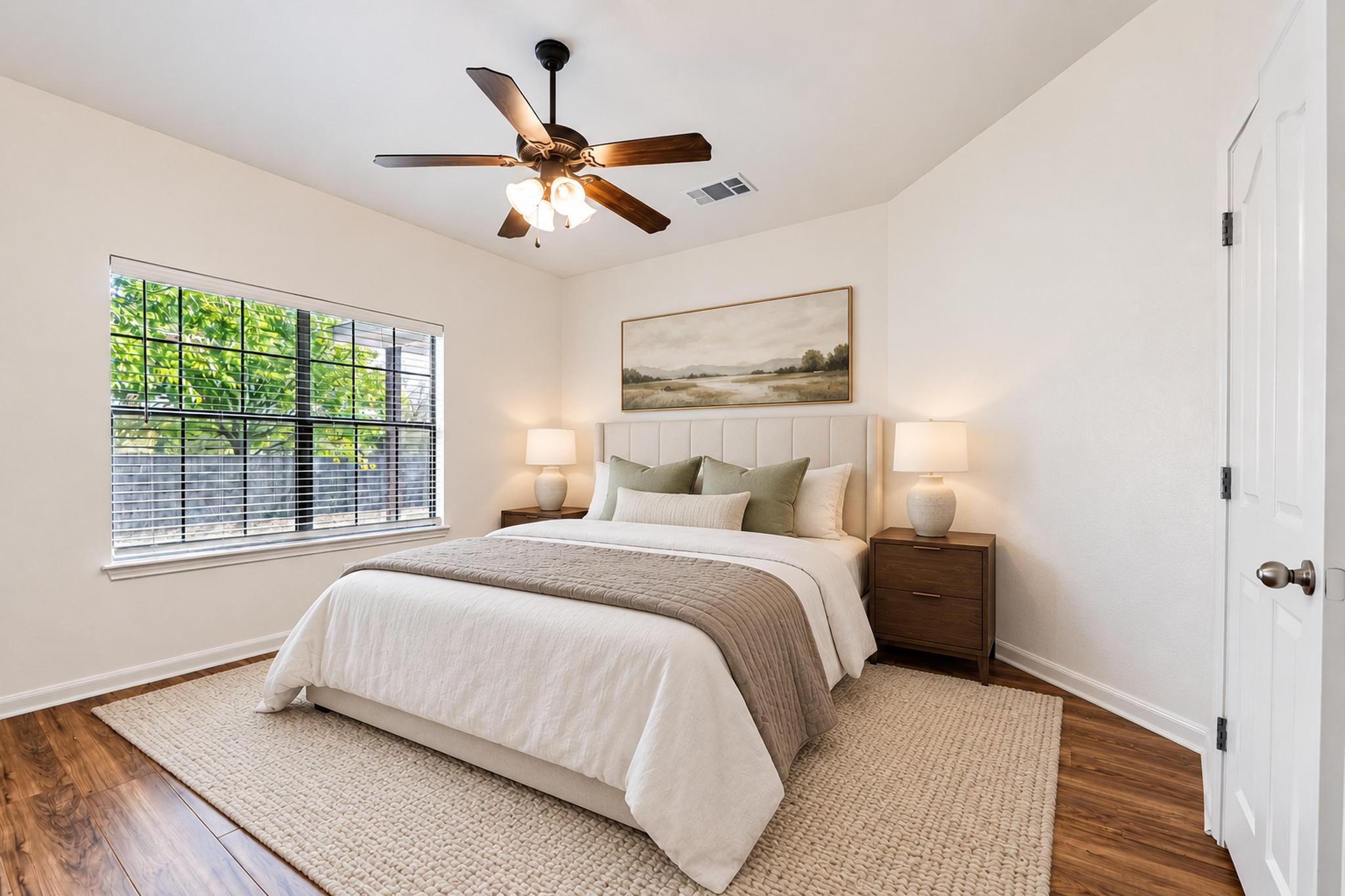150 Engineers Pass Jarrell, TX 76537 - Photo 26 of 40 Rich wood-look flooring and a large window define this comfortable bedroom space.