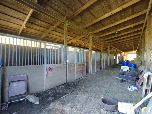 a view of a backyard with sitting area
