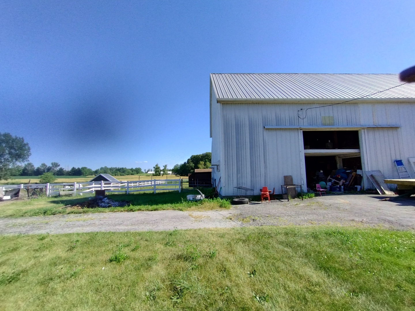 29153 South Klemme Road Beecher, IL 60401 - Photo 18 of 38 a view of a backyard with table and chairs and a fire pit