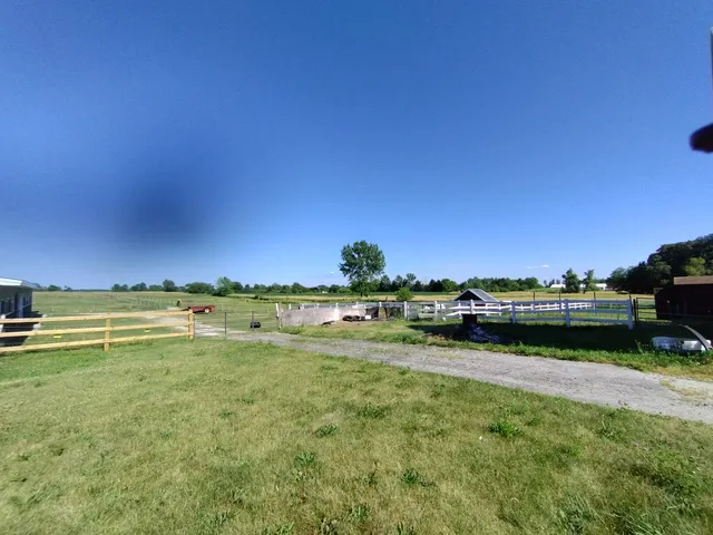 a view of a lake with houses in the back