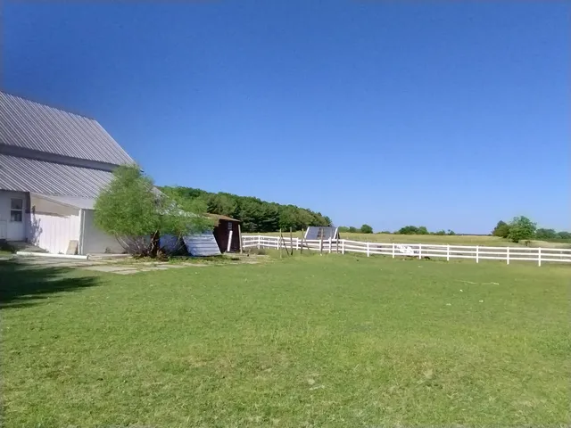 a view of a green field with clear sky