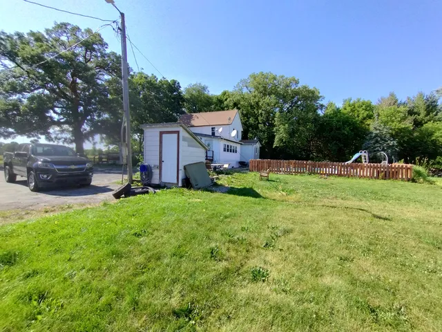 a view of backyard with house