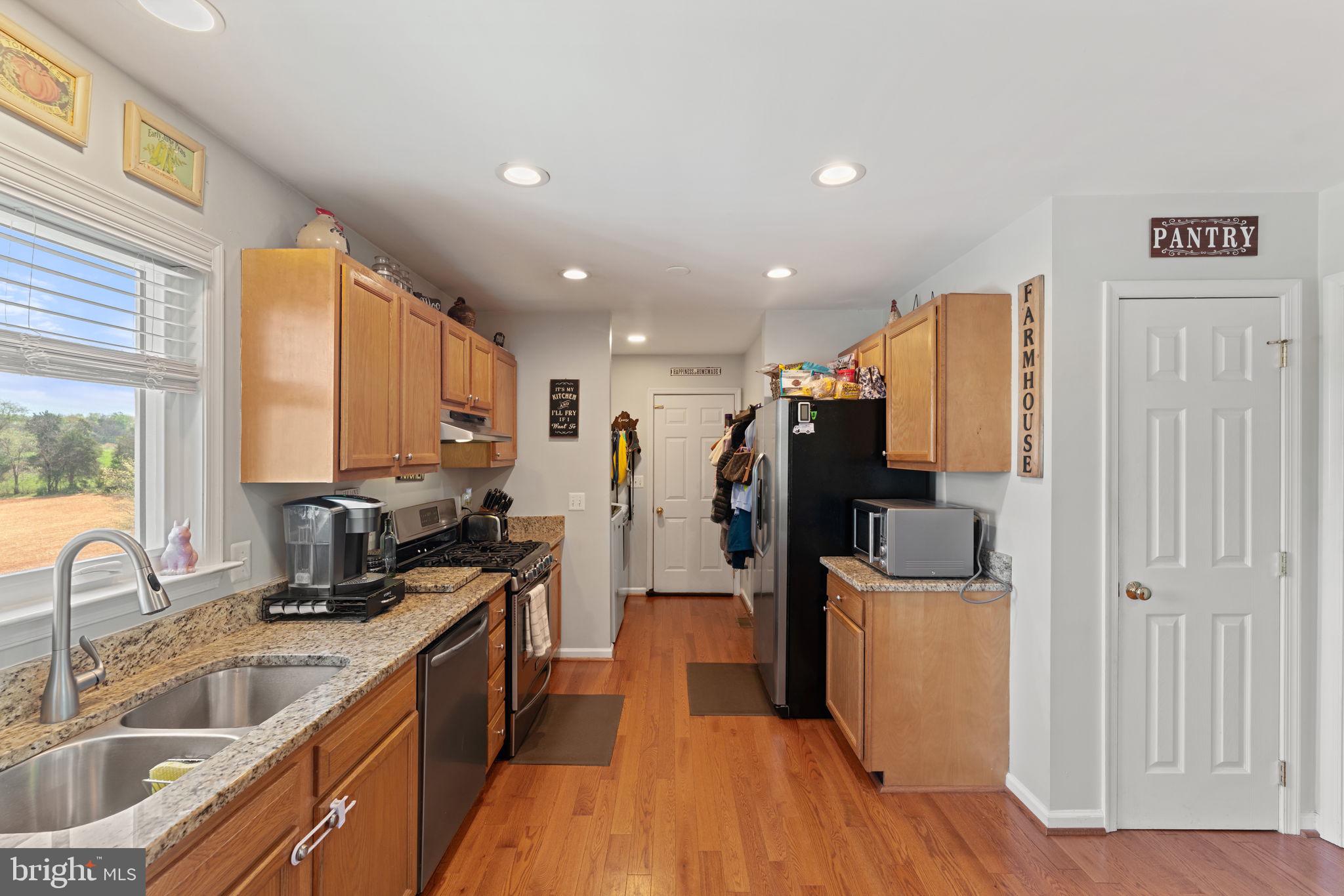 1388 Novum Church Road Reva, VA 22735 - Photo 20 of 65 a kitchen with sink refrigerator and cabinets