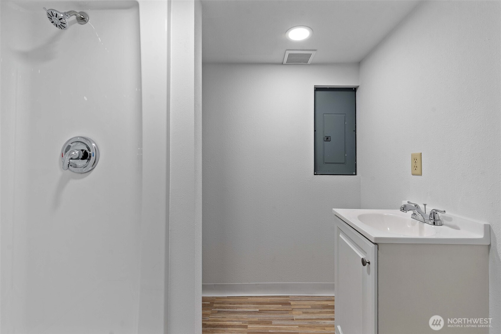 203 Fuller Street Wenatchee, WA 98801 - Photo 18 of 29 a bathroom with a sink and a mirror
