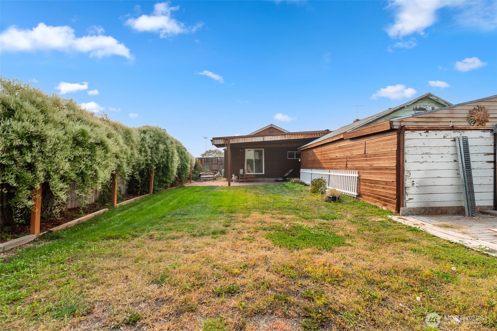 203 Fuller Street Wenatchee, WA 98801 - Photo 26 of 29 a view of a house with backyard and garden