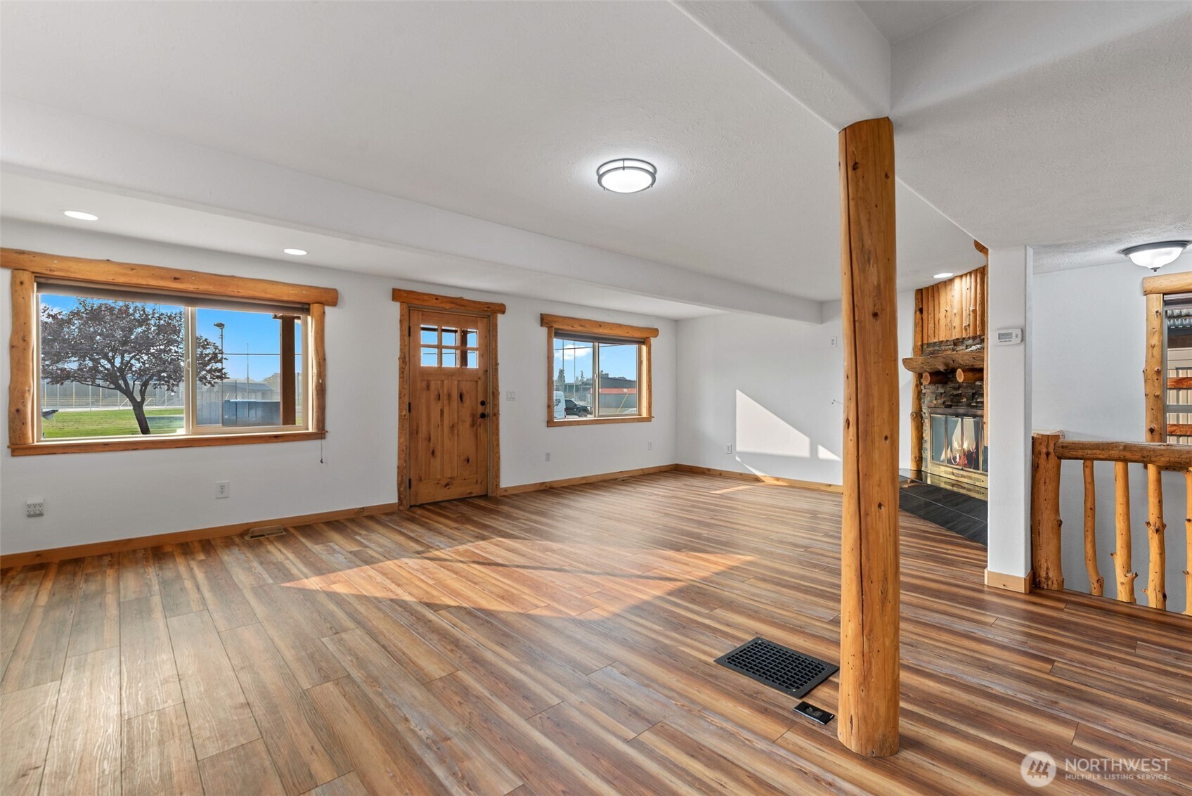 203 Fuller Street Wenatchee, WA 98801 - Photo 8 of 29 a view of an empty room with window and wooden floor